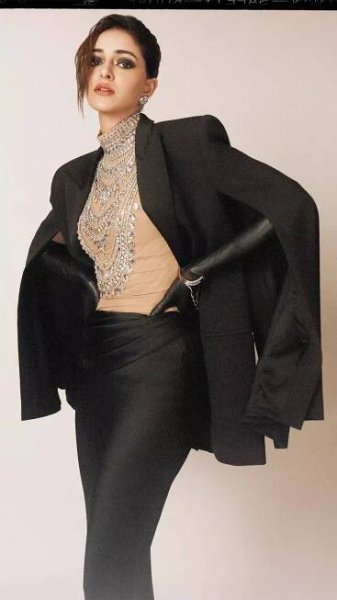 Ananya Panday stuns in a dramatic black gown with a cape blazer and a bedazzled bodysuit