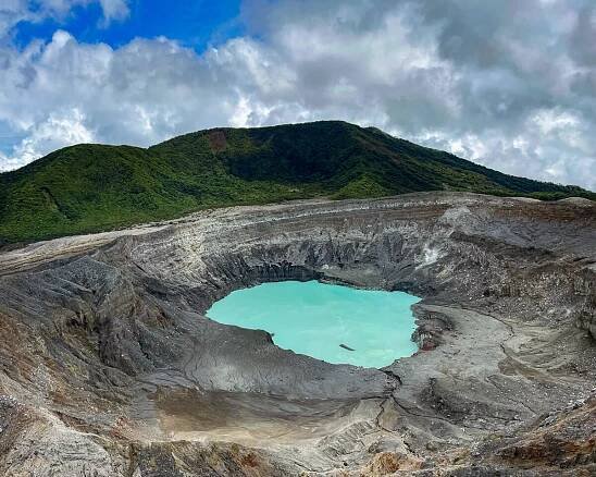 the blue crater lake of the Poas Volcano in Costa Rica