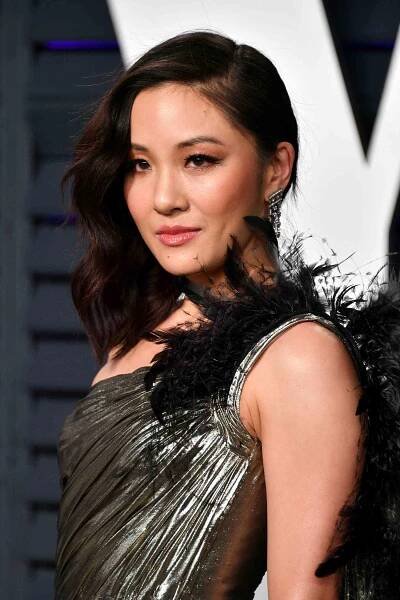 Constance Wu wearing short side-swept hair