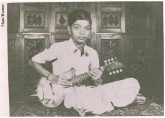 Figure 1. Portrait of U. Srinivas in 1983 with his Karnatak mandolin (Raman, Sruti No. 1 1983).  of this sticky uptight stuff. (Personal interview with author, August 2007)  fresh air. Man, finally somebody can come and shake this thing up and get out 