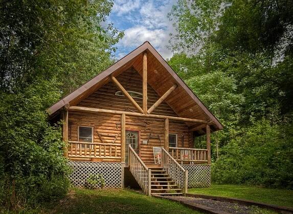 A log cabin tucked away in a picturesque mountain meadow