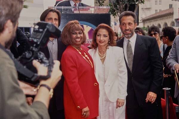 American actor Andy Garcia, Cuban singer Celia Cruz, Cuban-American singer Gloria Estefan and Cuban-American musician and producer Emilio Estefan pose for photographers as Gloria receives her Walk of Fame Star on the Hollywood Walk of Fame, California, 3rd February 1993. 