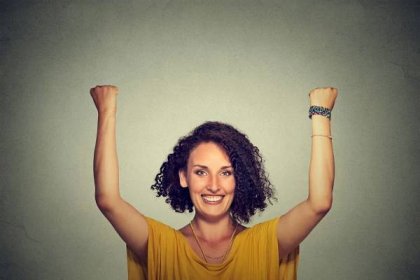 Successful woman with arms up celebrating — Stock Image