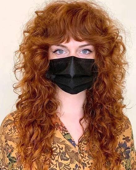 Curled Wolf Cut with a Fringe on Long Red Hair