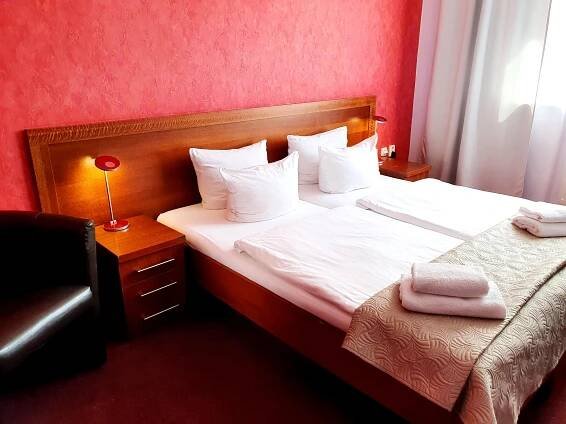 Postel nebo postele na pokoji v ubytování Relax Inn