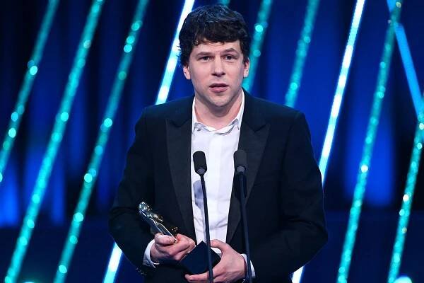 Jesse Eisenberg accepts the Supporting Actor Award, on behalf of Kieran Culkin for 'A Real Pain' on stage during the EE BAFTA Film Awards 2025 at The Royal Festival Hall on February 16, 2025 in London, England. 