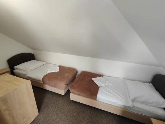 Posteľ alebo postele v izbe v ubytovaní Hotel Stará Škola