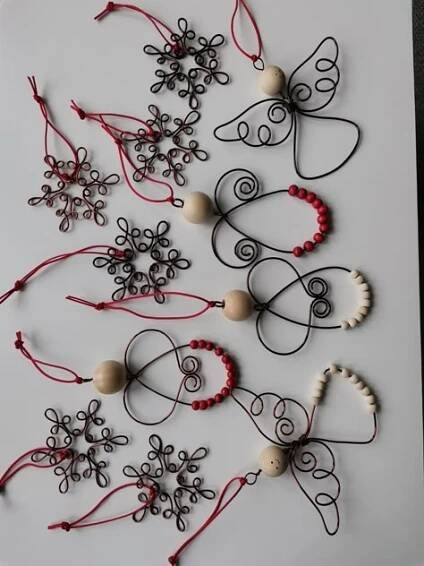 the string art is made with beads and beadwork, which look like snowflakes