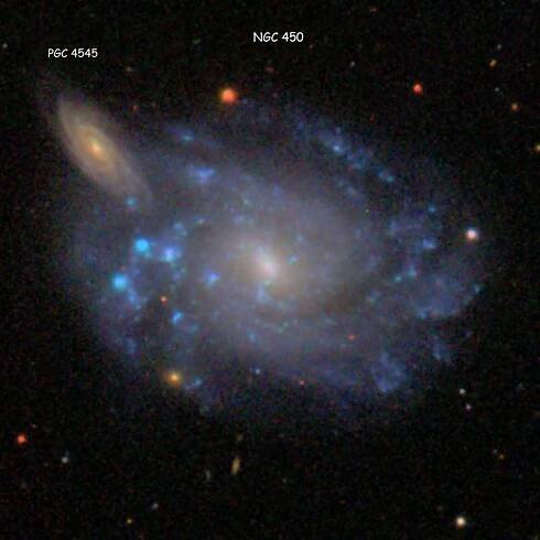 SDSS image of spiral galaxy NGC 450 and its far more distant apparent companion, spiral galaxy PGC 4545