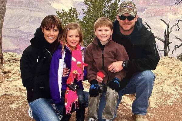 Chris Kyle smiles with wife Taya and their two kids McKenna and Colton at the Grand Canyon in 2012.