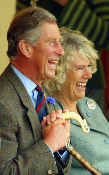 Prince Charles and Camilla Parker Bowles laughing together.