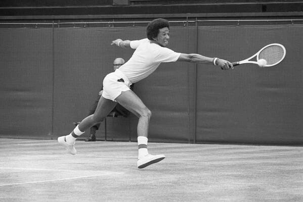 Arthur Ashe hitting a backhand shot