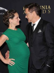 Robert Downey Jr. (R) and producer Susan Downey arrive at the BAFTA Los Angeles Jaguar Britannia Awards at The Beverly Hilton Hotel on October 30, 2014 in Beverly Hills, California