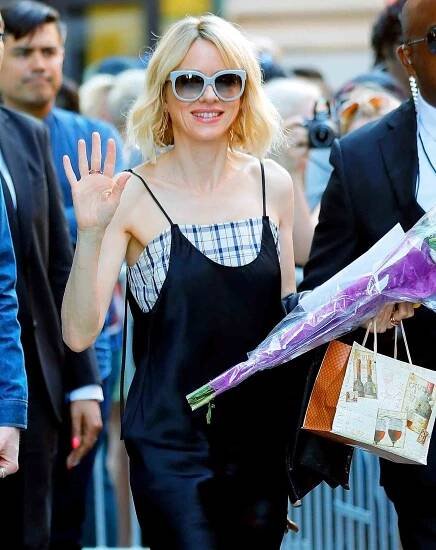 EXCLUSIVE: Naomi Watts is all smiles when carrying a bouquet of flowers given to her from an adoring fan in New York