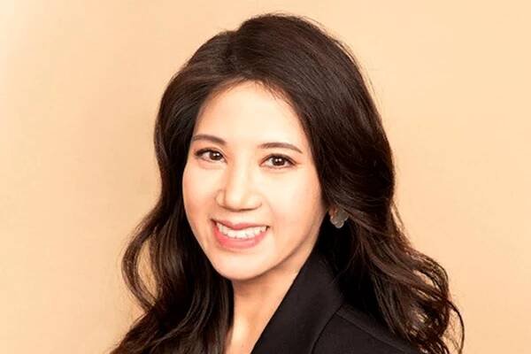 A portrait of a smiling woman