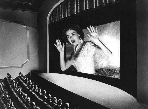 A black and white collage of a darkened movie theater, overlaid with a cutout of Barbara Rush positioned over the film screen to make it appear as if she is popping out of it.