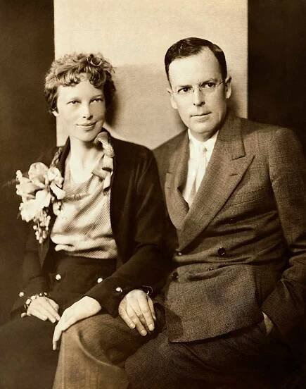 Amelia Earhart and her husband, George Palmer Putnam, are shown seated.