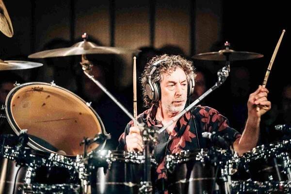 Simon Phillips close up playing drums during Protocol 30 Live concert at Little Big Beat Studios