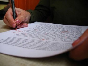Editing an Essay with red pen