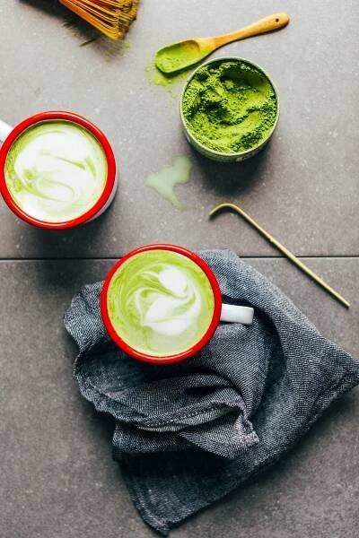 Two mugs of the best vegan Matcha Latte made from coconut and macadamia nut milks