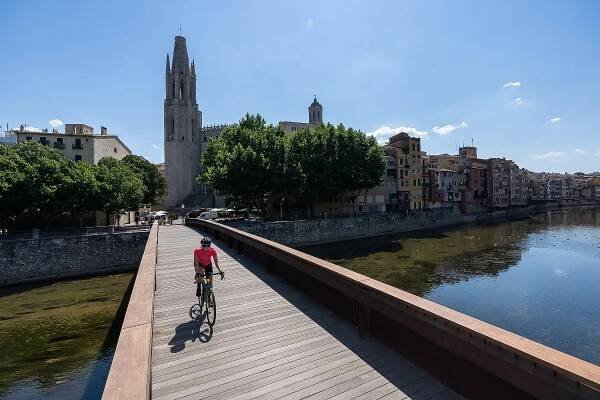 cycling-over-girona-bridge.jpg