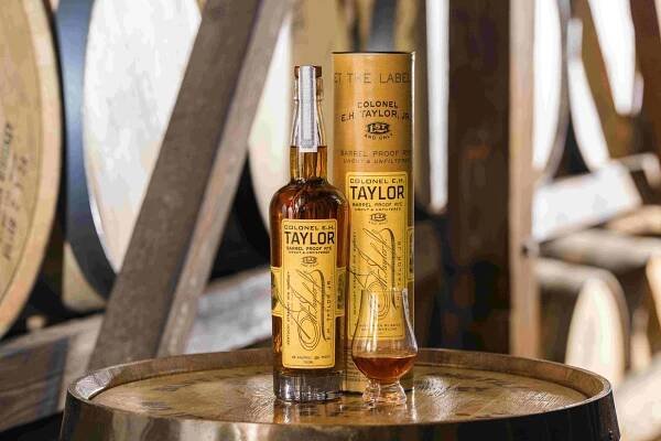 bottle of eh taylor whiskey in a rickhouse