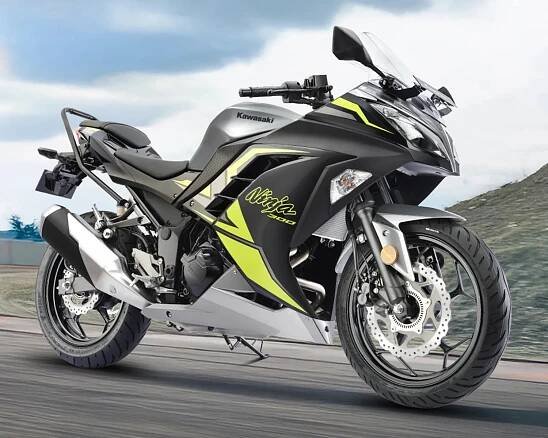 Sporty Kawasaki Ninja 300 motorcycle in black and silver with neon yellow accents, featuring aerodynamic fairings, a clear windshield, and disc brakes on both wheels.