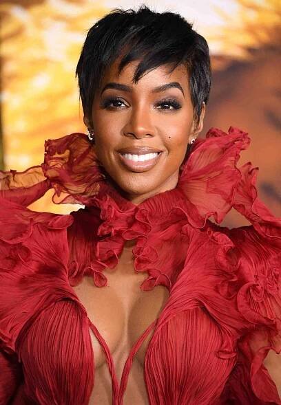 Kelly Rowland wears an ornate, high neck dress and pixie haircut to an LA premiere