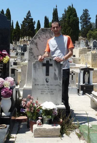 Eman Bonnici standing near Ratcliffe's grave in Addolorata cemetery - 1.JPG