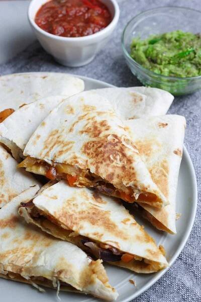 chicken fajita quesadilla slices on a plate
