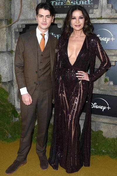 Catherine Zeta-Jones, Dylan Michael Douglas arrives at the Disney+ Original Series "National Treasure: Edge Of History" Red Carpet Event at El Capitan Theatre on December 05, 2022 in Los Angeles, California.