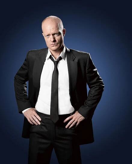 Portrait of Jake Wood in a suit.