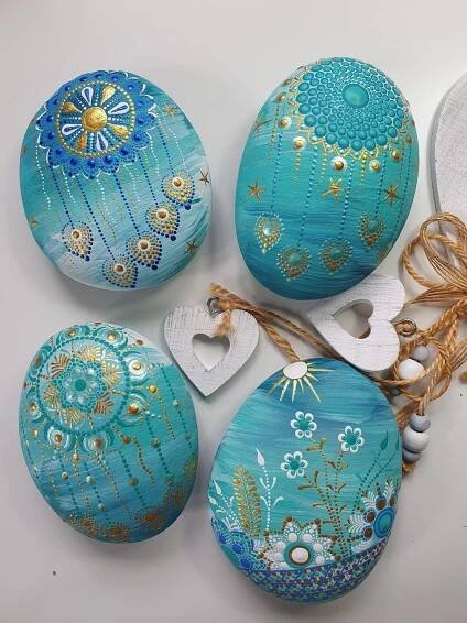 Rock Painting Art: Four Blue Painted Eggs on White Table