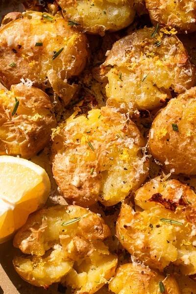 overhead photo of garnished lemon parmesan smashed potatoes 