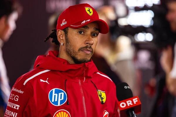 Lewis Hamilton of Great Britain speaking in the media pen.