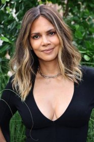 Halle Berry, 57, risks wardrobe malfunction in slashed gown at Michael Kors show