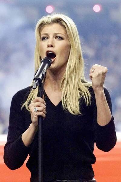 Faith Hill sings the U.S. national anthem before Super Bowl XXXIV at the Georgia Dome in Atlanta on Jan. 30, 2000
