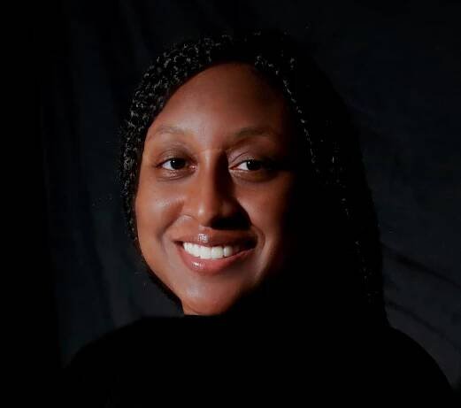 Headshot of Brittany Alston in front of a black backdrop.