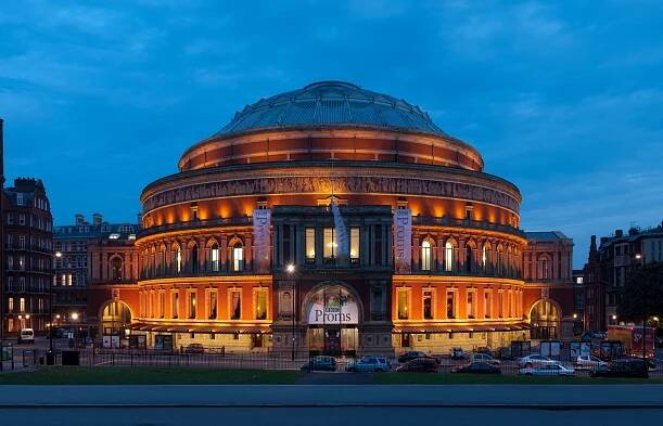 Image 32The Proms are held annually at the Royal Albert Hall during the summer. Regular performers at the Albert Hall include Eric Clapton who has played at the venue over 200 times. (from Culture of the United Kingdom)