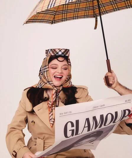 Meg Stalter reads the news for Glamour cover shoot editorial