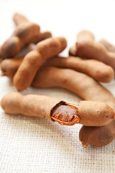 tamarind pods on a beige background