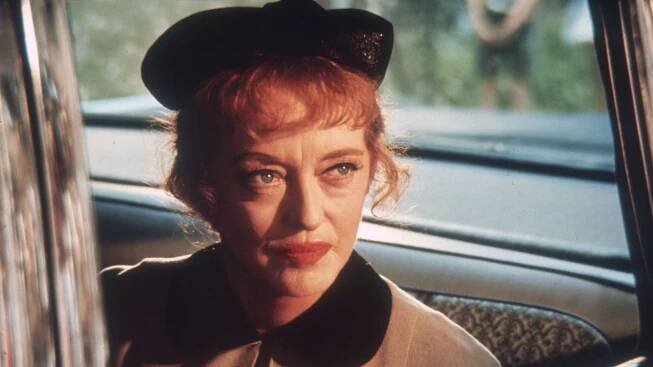 Forget Bette Davis' eyes, her 1950s living room features the romantic trend we're coveting for 2026 – it proves that floral curtains are truly timeless
