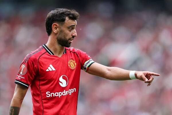 Manchester United soccer player in red uniform.