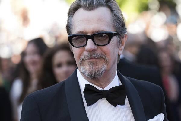 Gary Oldman poses for photographers upon arrival at the premiere of the film 'The Man Who Killed Don Quixote' and the closing ceremony of the 71st international film festival, Cannes, southern France, Saturday, May 19, 2018. (Photo by Vianney Le Caer/Invision/AP)
