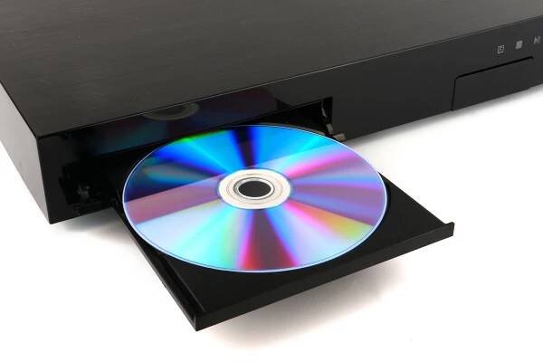 Black CD, DVD player insert to dvd player close-up isolated on white background — Stock obrázek