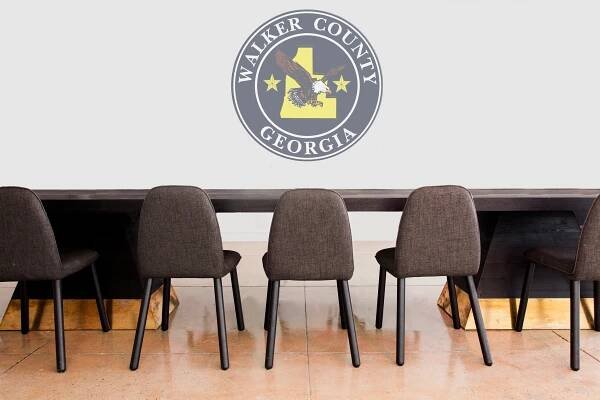 Walker County Government logo with tables and chairs