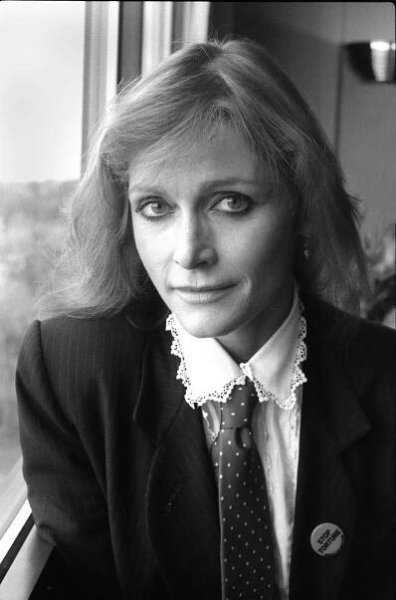 Image may contain Tie Accessories Accessory Face Human Person Margot Kidder Female Clothing Apparel Coat and Suit