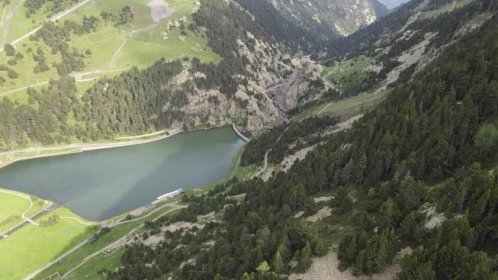 Free stock video - Aerial view of a dam located on a mountainside in the pyrenees