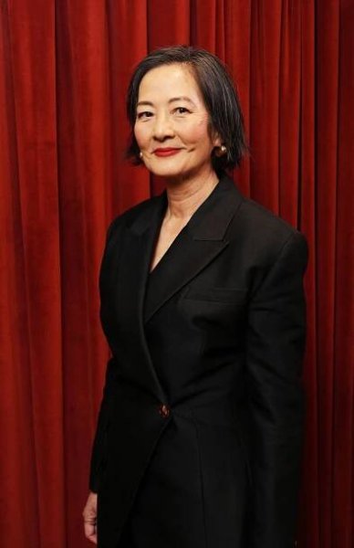 Image may contain Rosalind Chao Blazer Clothing Coat Jacket Adult Person Face Head Photography Portrait and Happy
