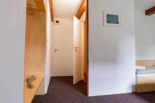 a room with a door leading to a bedroom at Chata Prim in Deštné v Orlických horách